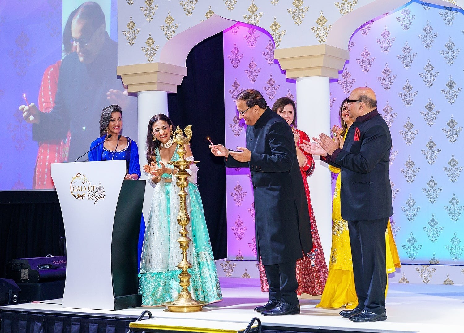 A symbolic lighting of the lamp to celebrate Deepavali, the Festival of Light (from left to right): Ms Sharanjit Leyl, Emcee of the Gala of Light 2019; Ms Samia Khan, Co-Founder of the Gala of Light 2019; Guest-of-Honour Mr S. Iswaran, Minister for Communications and Information and Minister-in-charge of Trade Relations; Mrs Kay Iswaran, Chairperson for Compassion Fund Ltd; Ms Bina Rampuria, Co-Founder of the Gala of Light 2019 and Mr Alok Kochhar, President, Beyond Social Services