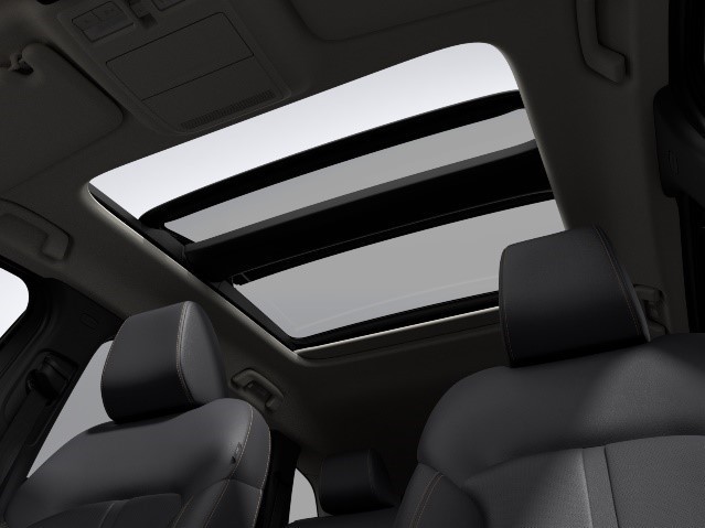 The interior of a car with a sunroof

Description automatically generated